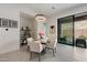 Bright dining room features a modern chandelier and a sliding glass door to the backyard at 14551 N Adero Canyon Dr, Fountain Hills, AZ 85268