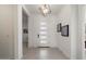 Bright entryway featuring modern door with glass inserts, tile flooring, and stylish light fixture at 14551 N Adero Canyon Dr, Fountain Hills, AZ 85268