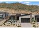 This home features modern architecture, desert landscaping, and a mountain view at 14551 N Adero Canyon Dr, Fountain Hills, AZ 85268
