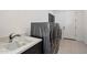 This laundry room features modern appliances, sink, and plenty of counter space at 14551 N Adero Canyon Dr, Fountain Hills, AZ 85268
