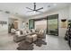 Spacious living room with tile floors, comfortable seating, and seamless transition to the outdoor area at 14551 N Adero Canyon Dr, Fountain Hills, AZ 85268