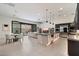 Spacious open-concept featuring a modern kitchen island, dining table, and comfortable living area at 14551 N Adero Canyon Dr, Fountain Hills, AZ 85268