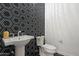 Stylish powder room with unique tile accent wall and pedestal sink at 14551 N Adero Canyon Dr, Fountain Hills, AZ 85268