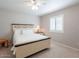 Neutral bedroom with a carpeted floor, a ceiling fan, and a shuttered window at 14627 N 55Th Pl, Scottsdale, AZ 85254