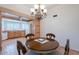 Dining room and kitchen area featuring a chandelier and open concept design at 14627 N 55Th Pl, Scottsdale, AZ 85254