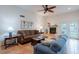 Bright living room featuring fireplace, neutral walls, earth-tone flooring and comfortable furnishings at 14627 N 55Th Pl, Scottsdale, AZ 85254
