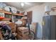 Storage space with shelves, water heater, boxes and golf clubs; perfect for organized household storage at 14627 N 55Th Pl, Scottsdale, AZ 85254