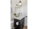 Charming powder room features sleek vanity with gold arched mirror and modern lighting at 1642 E Monte Vista Rd # 5, Phoenix, AZ 85006