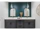 Elegant bathroom boasts a dual sink vanity with white countertop and modern fixtures, complemented by stylish lighting at 1642 E Monte Vista Rd # 5, Phoenix, AZ 85006