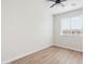 Bright bedroom with laminate floors, a window with blinds, and neutral walls creating a serene and inviting atmosphere at 1642 E Monte Vista Rd # 5, Phoenix, AZ 85006