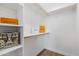 Walk-in closet with multiple shelves and wood trim at 1642 E Monte Vista Rd # 5, Phoenix, AZ 85006