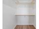 Walk-in closet with ample shelving and storage space, providing an organized and functional area at 1642 E Monte Vista Rd # 5, Phoenix, AZ 85006
