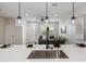 Modern kitchen features stainless steel sink, pendant lighting, and an open view to the cozy living room at 1642 E Monte Vista Rd # 5, Phoenix, AZ 85006