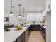 Well-lit kitchen featuring a long quartz island, stainless steel appliances, and open living area at 1642 E Monte Vista Rd # 5, Phoenix, AZ 85006
