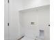 Clean laundry room featuring a utility sink, washer hookup, and dryer hookup and a shelf for storage at 1642 E Monte Vista Rd # 5, Phoenix, AZ 85006