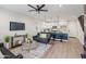 Open-concept living room with modern decor, adjacent kitchen, and staircase at 1642 E Monte Vista Rd # 5, Phoenix, AZ 85006