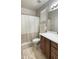 Neutral bathroom with a neutral vanity, mirror, toilet, and shower with a curtain at 18575 W Vogel Ave, Goodyear, AZ 85338