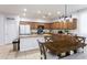 Spacious kitchen with wooden cabinets, granite countertops, and stainless steel appliances at 18575 W Vogel Ave, Goodyear, AZ 85338