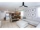 Open-concept living space with tile floors, modern lighting, and comfortable seating area at 18575 W Vogel Ave, Goodyear, AZ 85338
