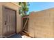 Enclosed backyard space featuring a privacy wall, gate, and storage unit at 19601 N 7Th N St # 1072, Phoenix, AZ 85024
