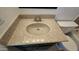 Bathroom vanity with a neutral color countertop, faucet, and toilet at 19601 N 7Th N St # 1072, Phoenix, AZ 85024