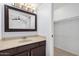 A bathroom with vanity, mirror and views to the closet at 19601 N 7Th N St # 1072, Phoenix, AZ 85024