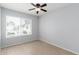 A cozy bedroom with a bright window dressed with blinds and a modern ceiling fan at 19601 N 7Th N St # 1072, Phoenix, AZ 85024
