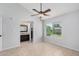 A bright bedroom with an en-suite bathroom and large window overlooking a lawn at 19601 N 7Th N St # 1072, Phoenix, AZ 85024