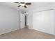 This spacious bedroom features a ceiling fan, closet, neutral paint and tile floors at 19601 N 7Th N St # 1072, Phoenix, AZ 85024