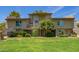 Inviting condo with green lawn, mature trees, and a private balcony at 19601 N 7Th N St # 1072, Phoenix, AZ 85024