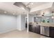 Open kitchen layout with stainless steel dishwasher and stone countertops at 19601 N 7Th N St # 1072, Phoenix, AZ 85024
