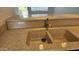 Close-up of a kitchen sink with neutral countertops and faucet at 19601 N 7Th N St # 1072, Phoenix, AZ 85024