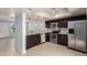 Modern kitchen featuring stainless steel appliances and dark wood cabinets at 19601 N 7Th N St # 1072, Phoenix, AZ 85024