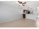 Open floorplan with tile floors, neutral paint, and open bar to kitchen at 19601 N 7Th N St # 1072, Phoenix, AZ 85024