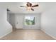 Bright living room featuring neutral paint, tile floors, and natural light at 19601 N 7Th N St # 1072, Phoenix, AZ 85024