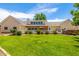 Expansive backyard featuring a lush lawn and an inviting patio area, perfect for outdoor activities and relaxation at 198 N Pecan Ct, Gilbert, AZ 85234