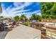 Wide angle shot of backyard with lush landscaping, BBQ, seating, outdoor kitchen and privacy fence at 198 N Pecan Ct, Gilbert, AZ 85234