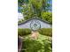 Charming community sign for 'The Groves of Gilbert', surrounded by lush greenery, welcoming residents and visitors at 198 N Pecan Ct, Gilbert, AZ 85234