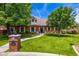 Charming brick home with well-maintained landscaping, lush green lawn, and a brick mailbox post at 198 N Pecan Ct, Gilbert, AZ 85234