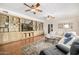 Cozy living room features built-in bookshelves, hardwood floors, and a comfortable seating area at 198 N Pecan Ct, Gilbert, AZ 85234