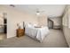 Serene bedroom with neutral tones, plush carpeting, a ceiling fan, and comfortable furnishings at 198 N Pecan Ct, Gilbert, AZ 85234
