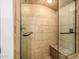 This shower has tile walls, a glass door, and a built-in bench at 198 N Pecan Ct, Gilbert, AZ 85234