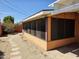 View of back of home featuring a covered sunroom with screen windows and gravel ground cover at 2027 N 81St St, Scottsdale, AZ 85257