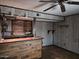 The basement has a wooden bar area, a ceiling fan, and an open floorplan at 2027 N 81St St, Scottsdale, AZ 85257