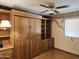 Bedroom with built in bookshelf, drawers and murphy bed at 2027 N 81St St, Scottsdale, AZ 85257