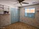 Bedroom with a fan, blue trim and bi-fold closet at 2027 N 81St St, Scottsdale, AZ 85257