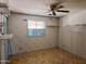 Bedroom with a fan, blue trim and shelves at 2027 N 81St St, Scottsdale, AZ 85257