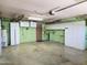 Spacious two car garage featuring built in shelving and cabinets, plus water heater at 2027 N 81St St, Scottsdale, AZ 85257