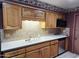 Well-lit kitchen equipped with stainless steel appliances, ample cabinetry, and sleek countertops for efficient cooking at 2027 N 81St St, Scottsdale, AZ 85257