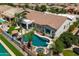 Aerial view of a charming home featuring a private backyard with a sparkling pool, spa, and lush landscaping for outdoor enjoyment at 2105 E San Carlos Pl, Chandler, AZ 85249